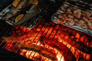 a close up of food cooking on a grill