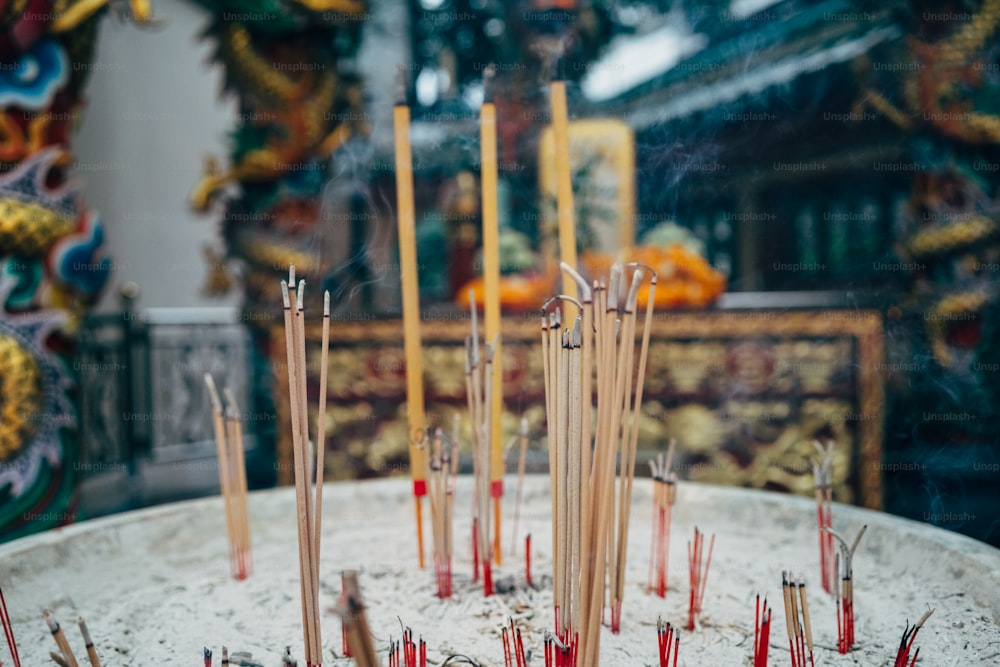 a white table topped with lots of sticks