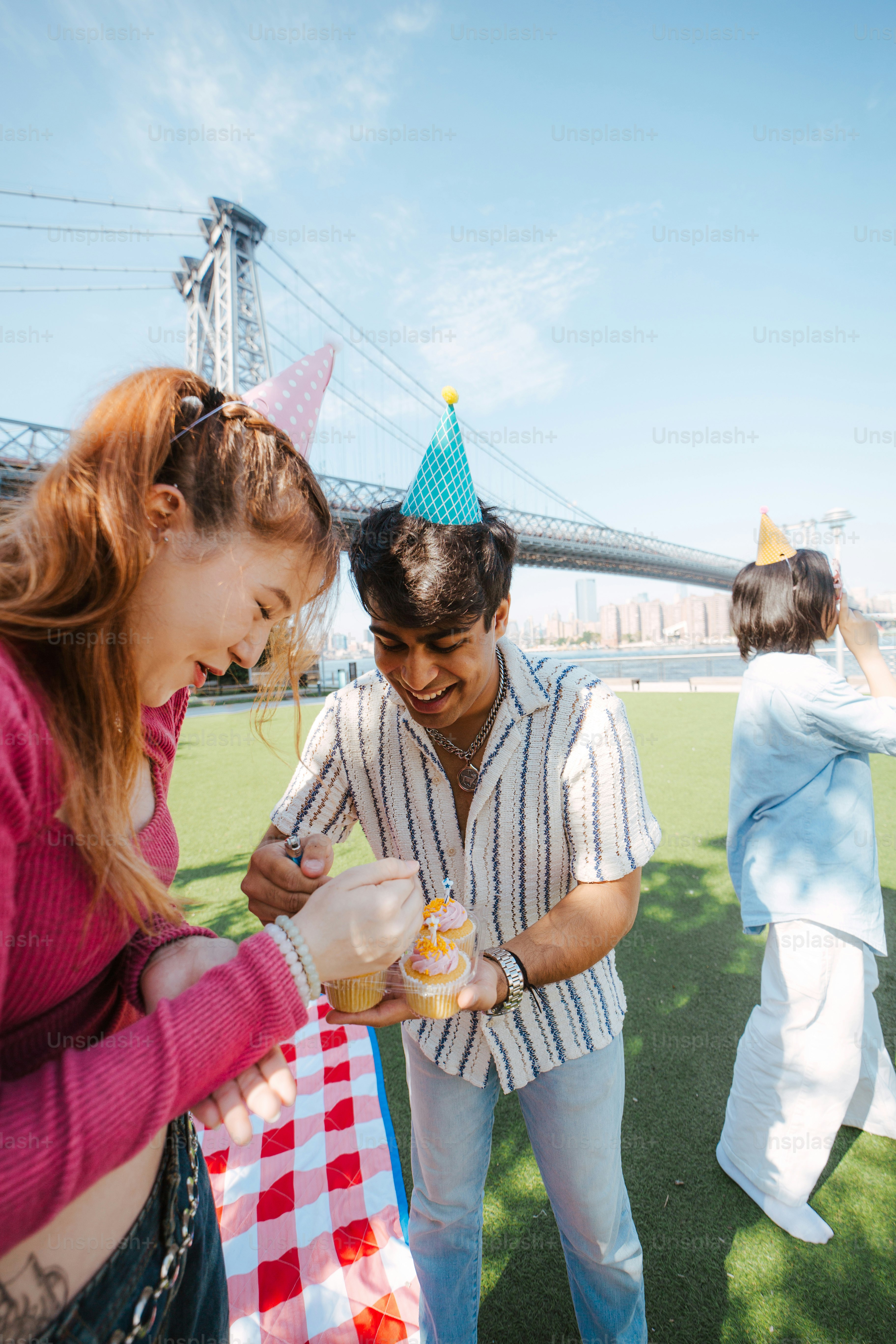 A group of people standing around a cake photo – Birthday Image on Unsplash