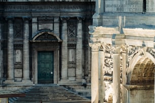 a large building with a green door and steps