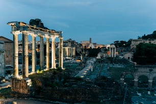 the ruins of the ancient city are lit up at night