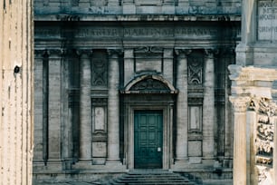 an old building with a green door and steps