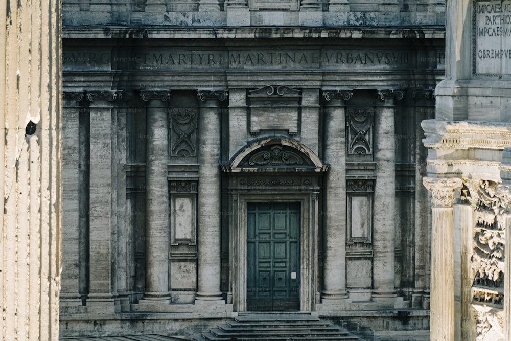 an old building with a green door and steps