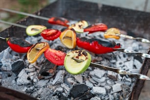 a bunch of food is being cooked on a grill