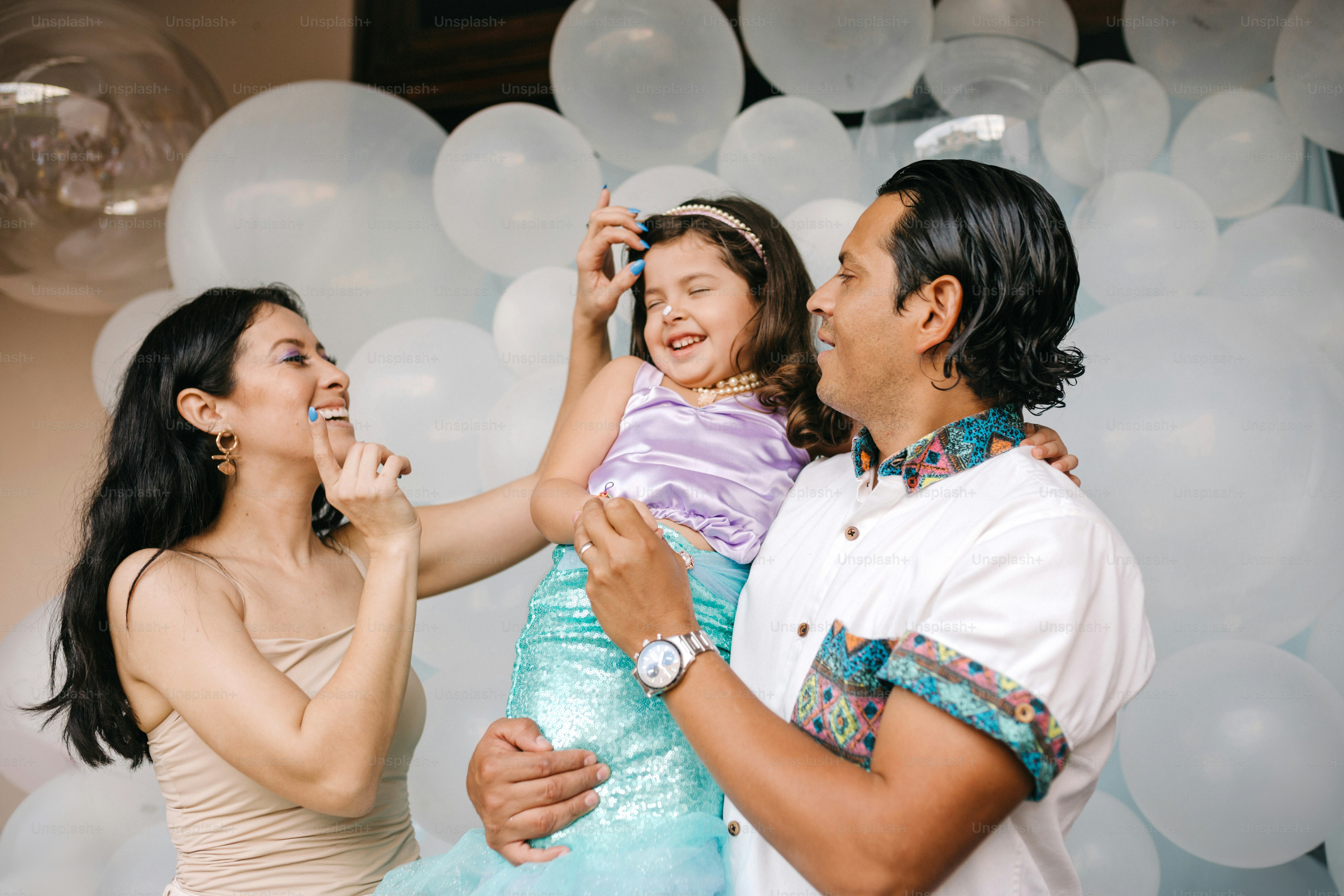 a man and a woman with a little girl