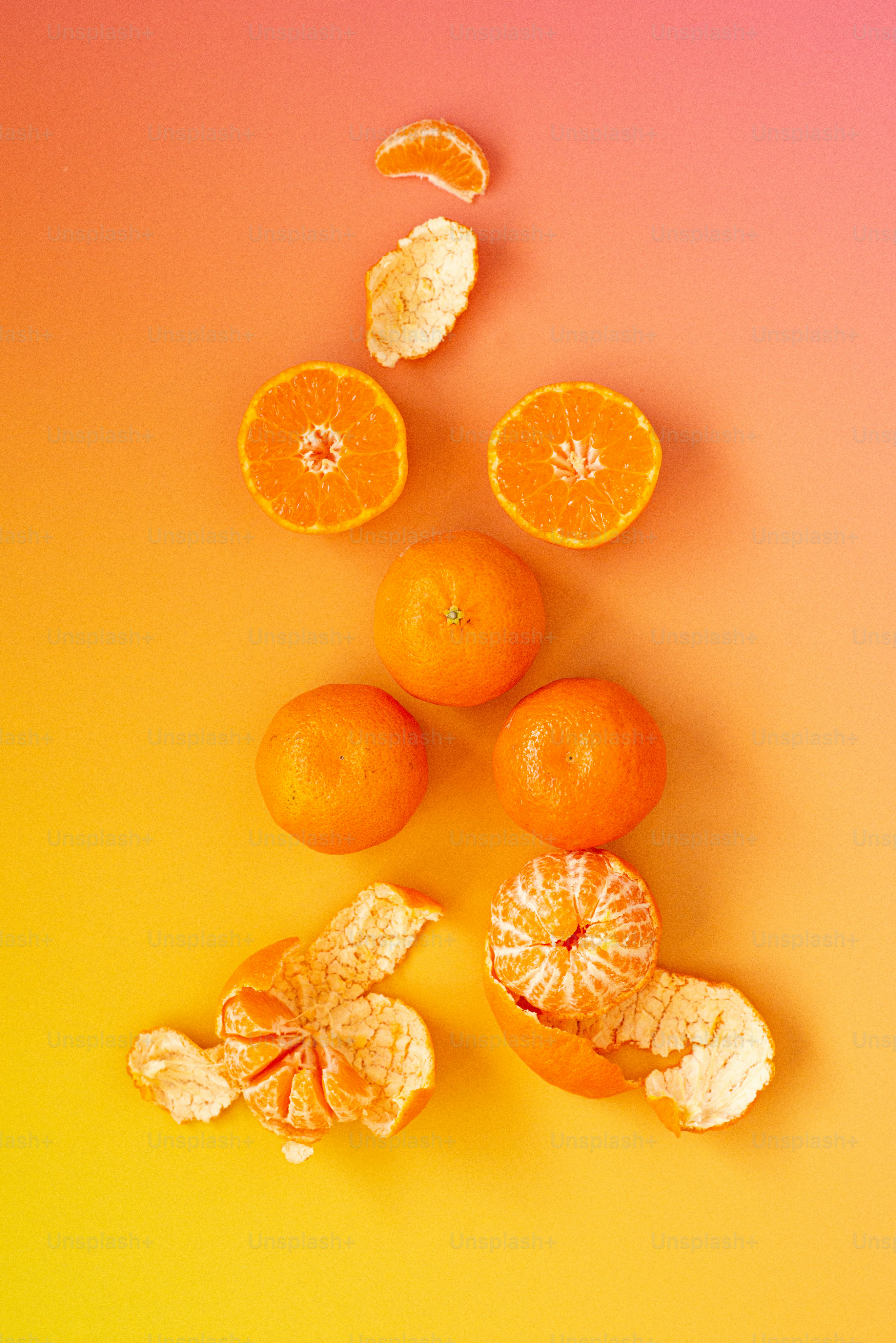 a group of oranges sitting on top of a yellow table