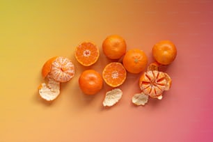 a group of oranges sitting on top of a table