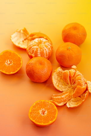 a group of oranges that are on a table