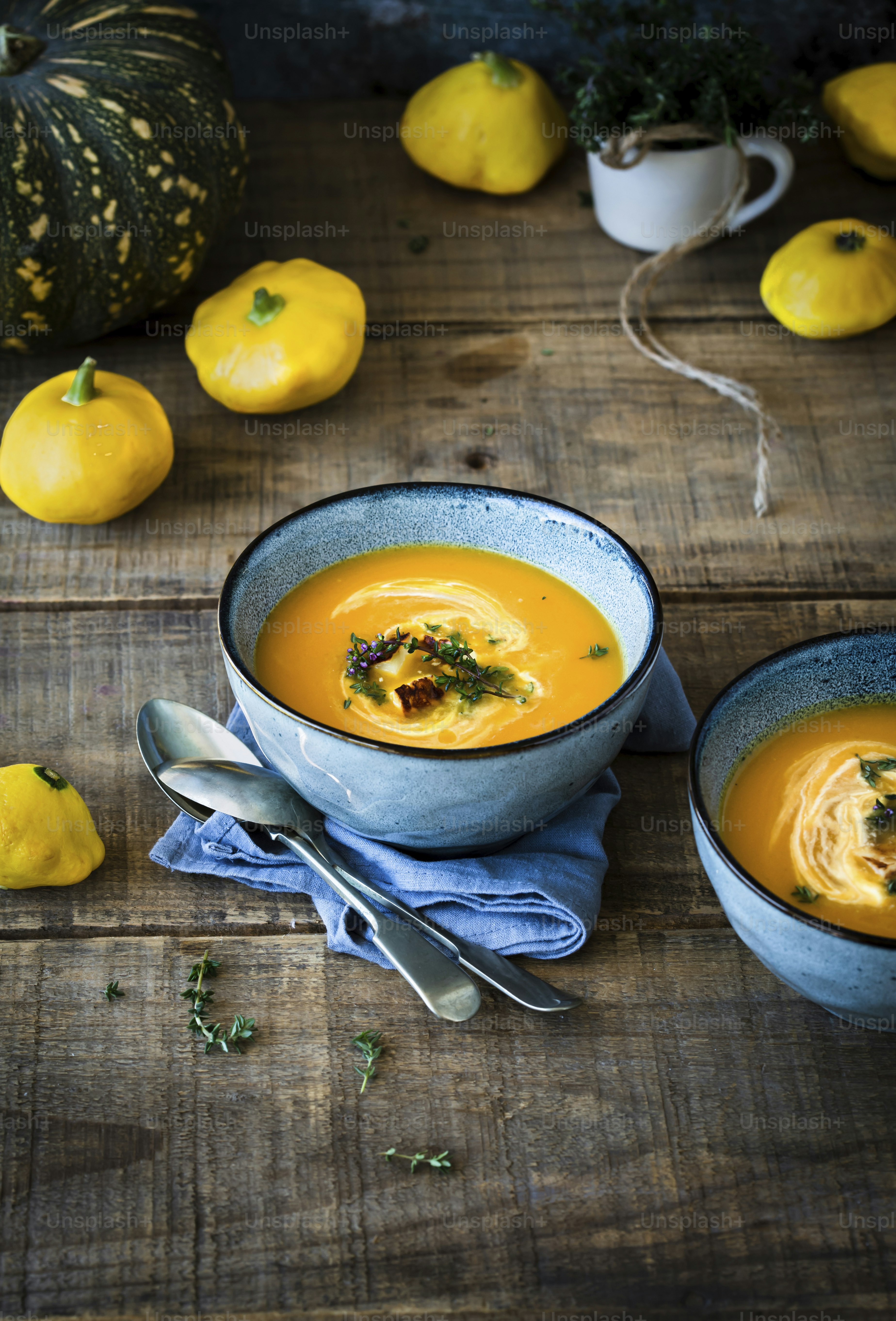 a couple of bowls of soup on a table