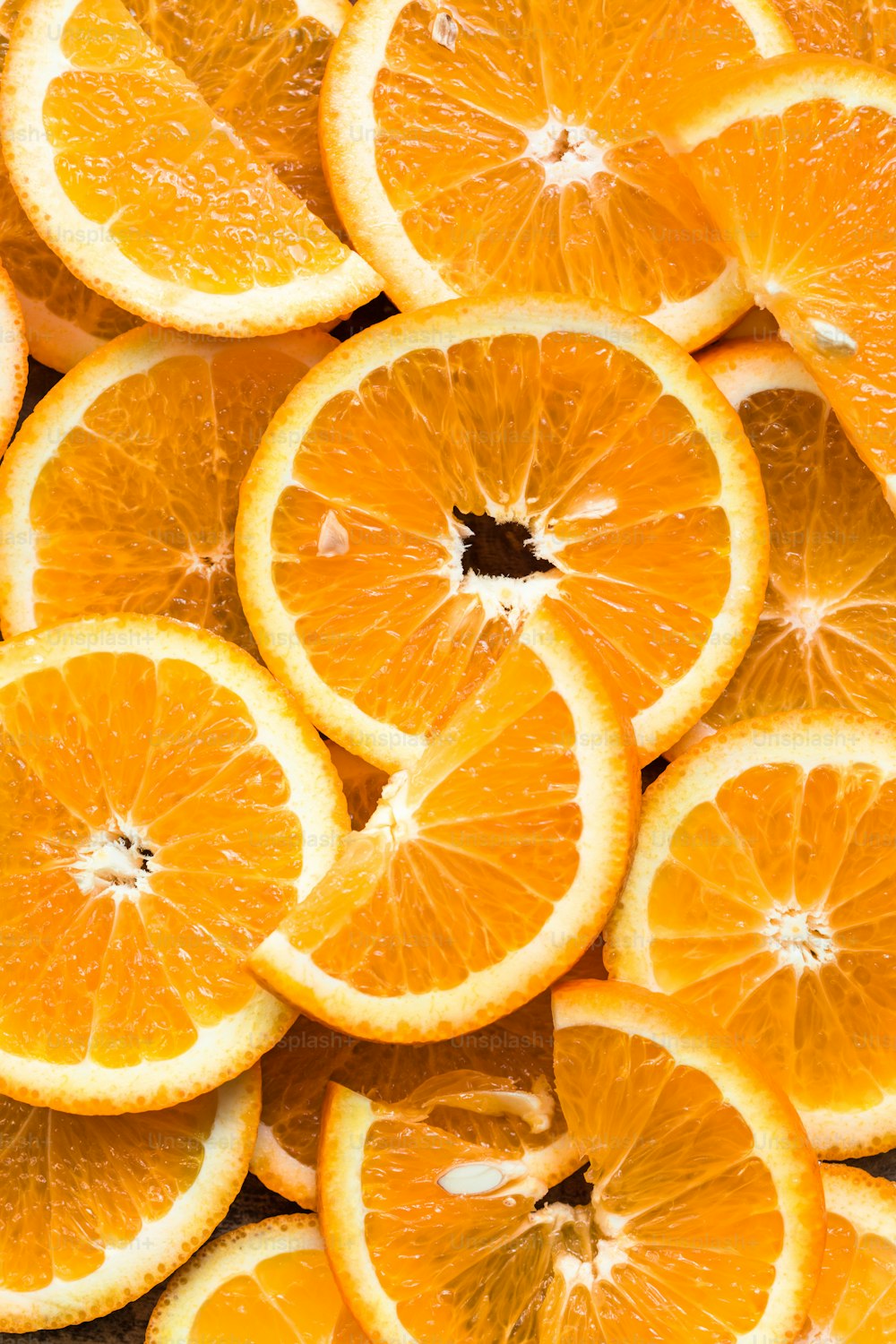 a bunch of oranges that are cut in half