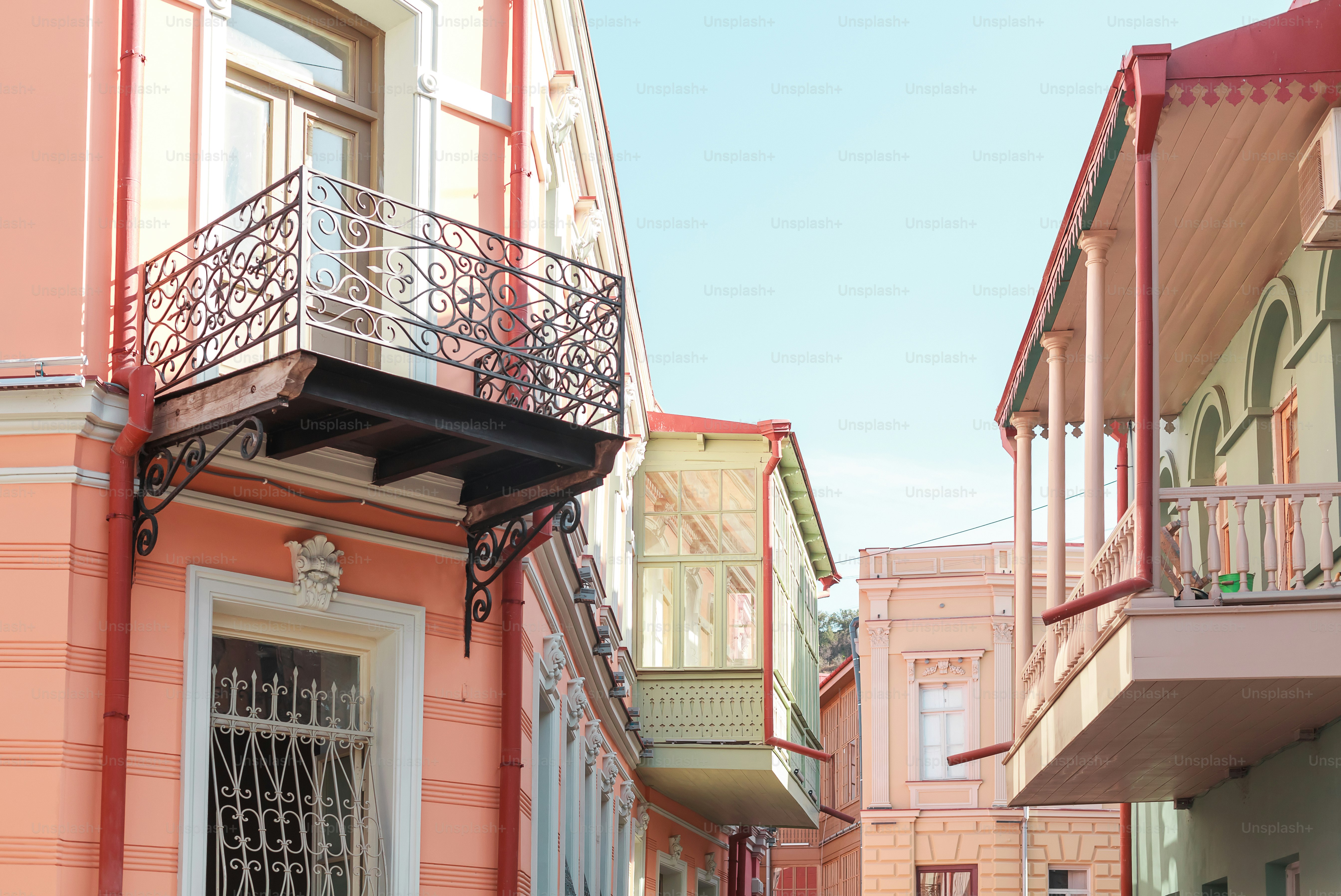 A row of buildings with balconies and a balcony photo – Buildings Image ...