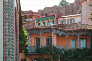 a building with a balcony and a clock on it