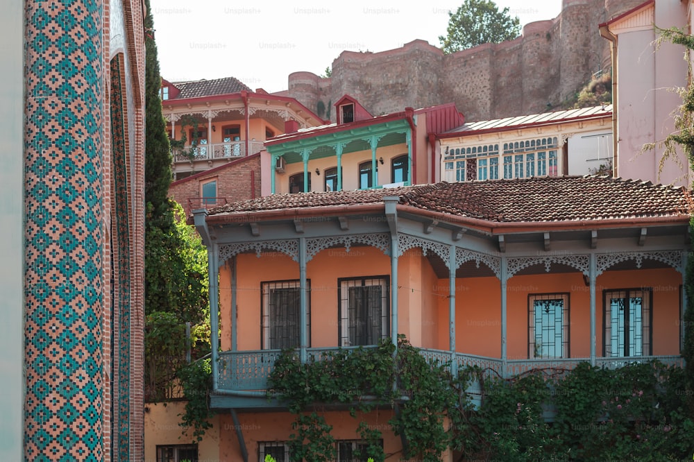 a building with a balcony and a clock on it