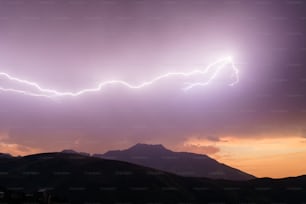 a couple of lightning strikes in the sky