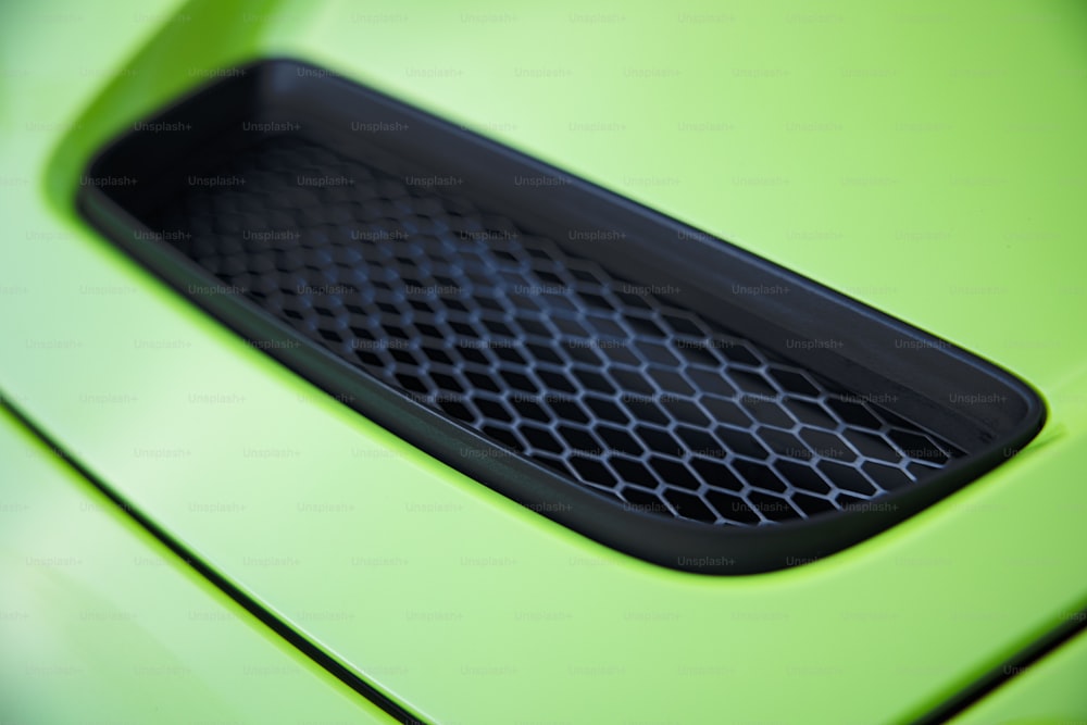 a close up of a green sports car