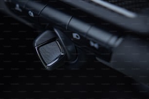 a close up of a car dashboard with a speaker