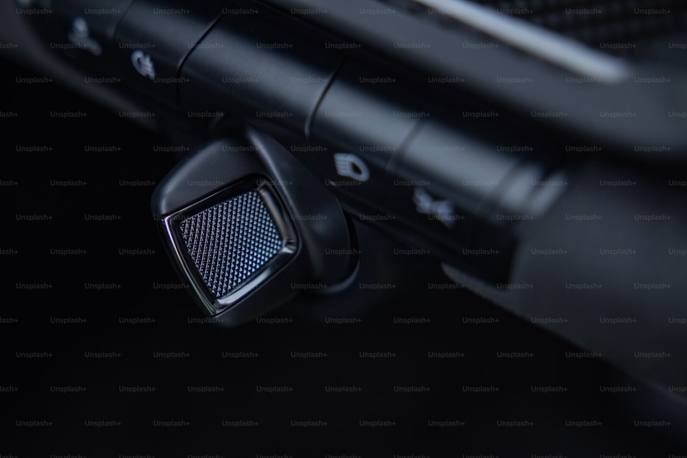 a close up of a car dashboard with a speaker