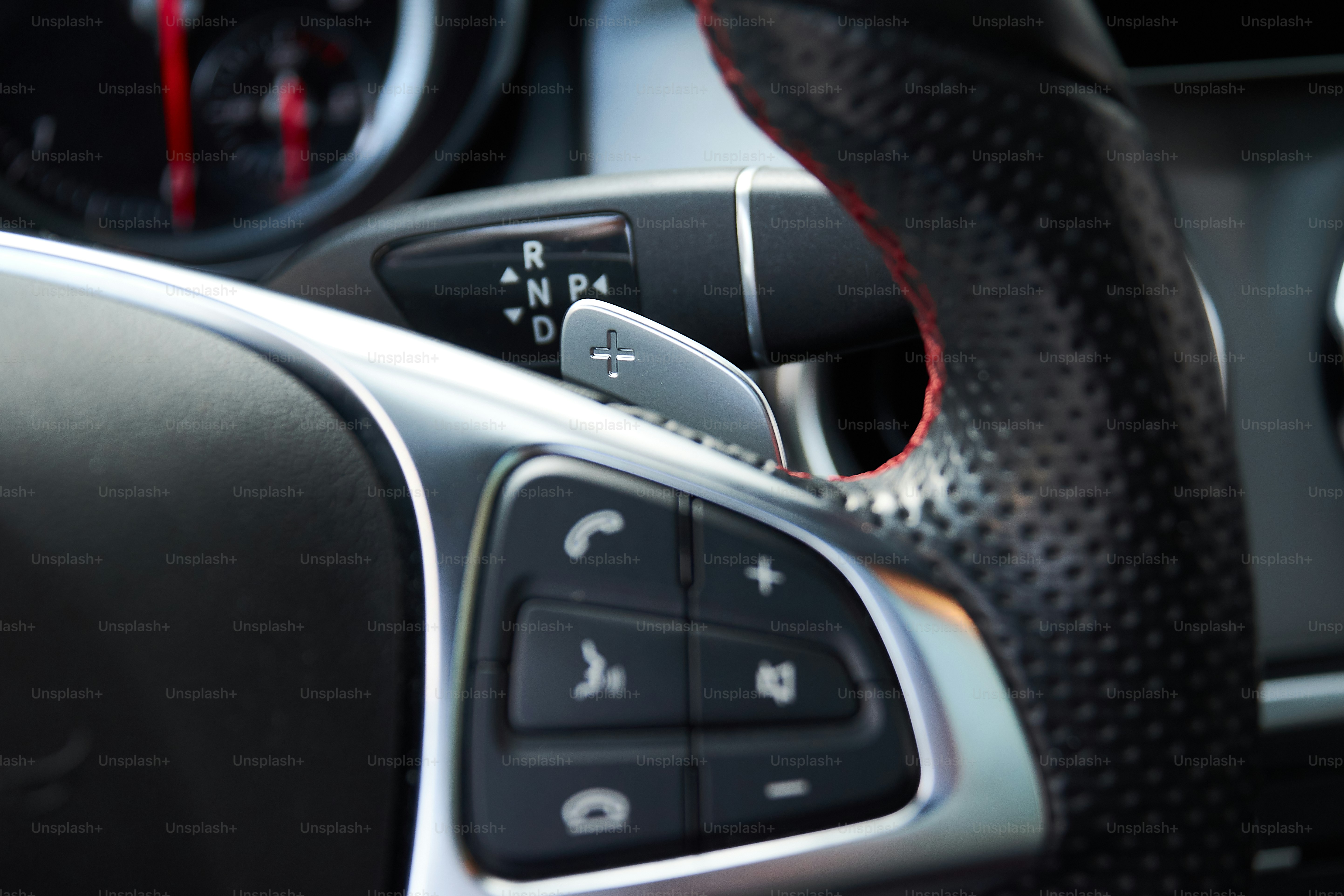 a close up of a steering wheel and dashboard of a car