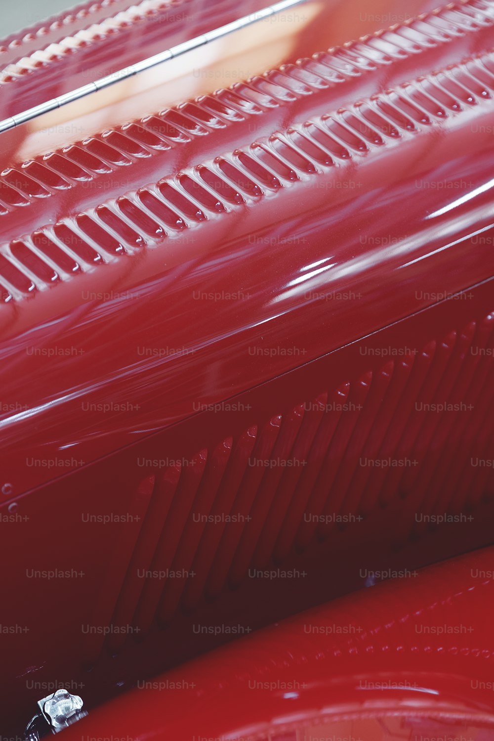 a close up of a shiny red car