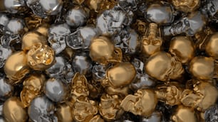 a pile of shiny gold and silver skulls