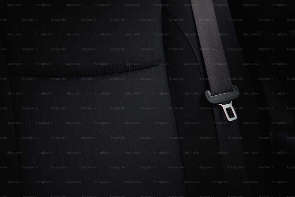 a close up of a seat belt on a car