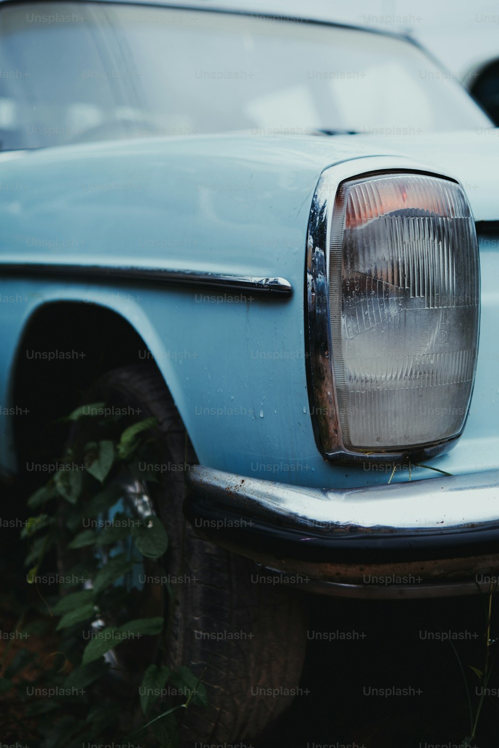 a close up of the front of a blue car