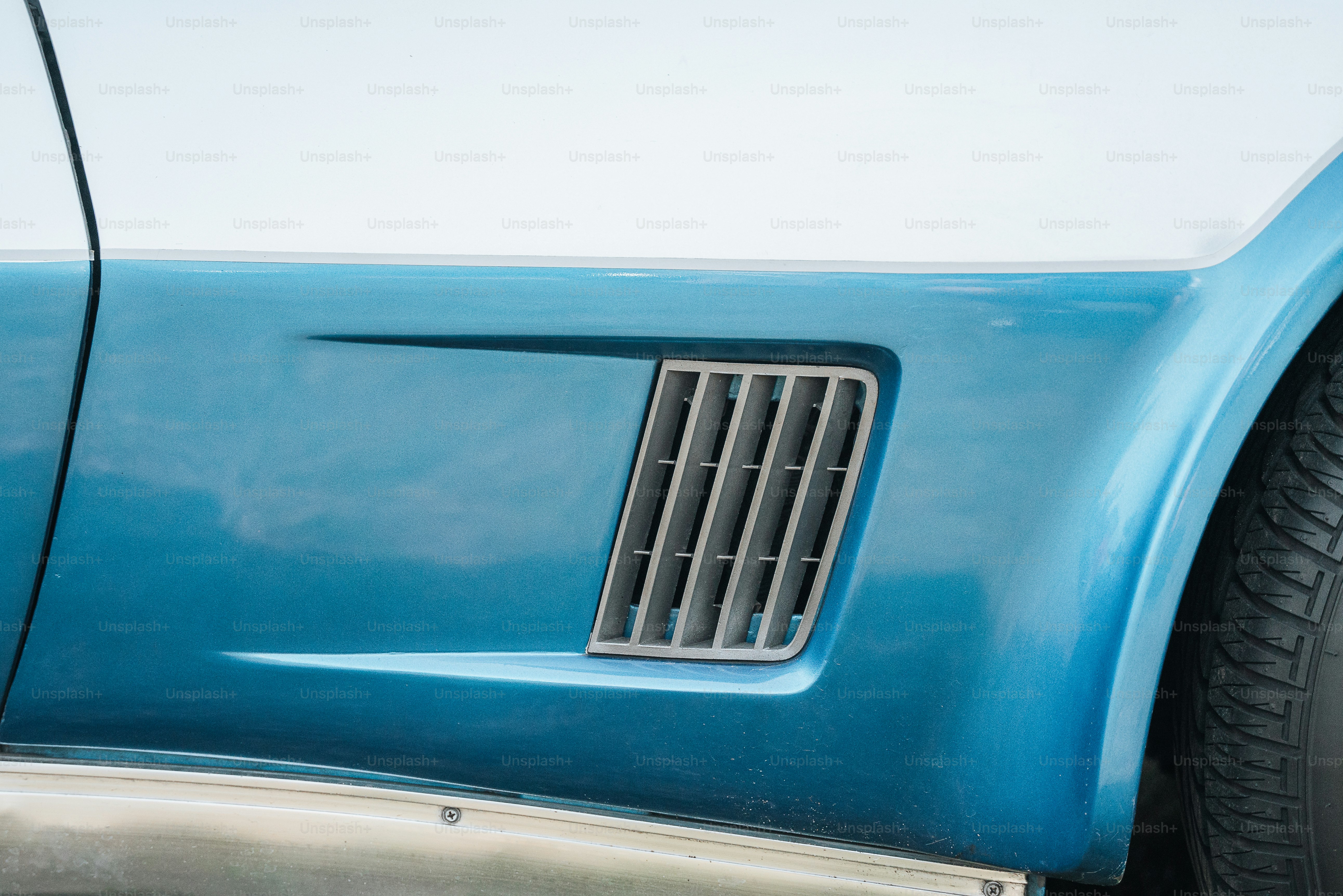 a close up of the front of a blue car