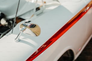 a close up of a door handle on a white car