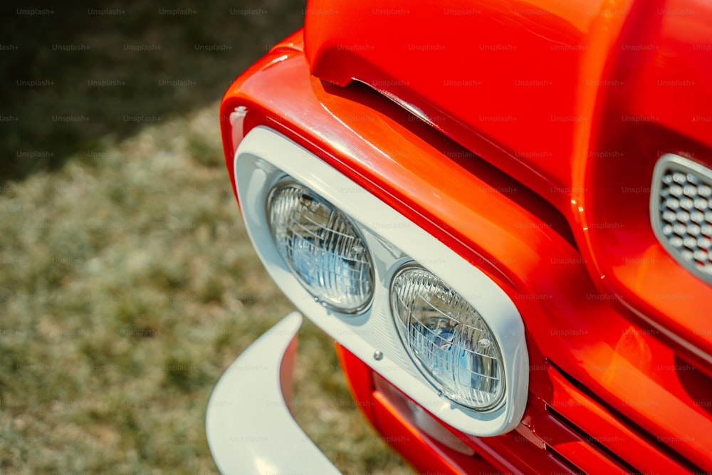 a close up of a bright red car headlight