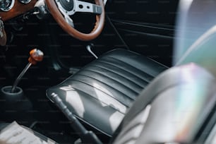 the interior of a car with a steering wheel and dashboard