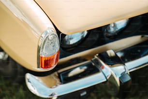 a close up of the tail light of a classic car