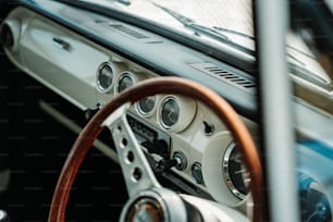 a close up of a steering wheel and dashboard of a car