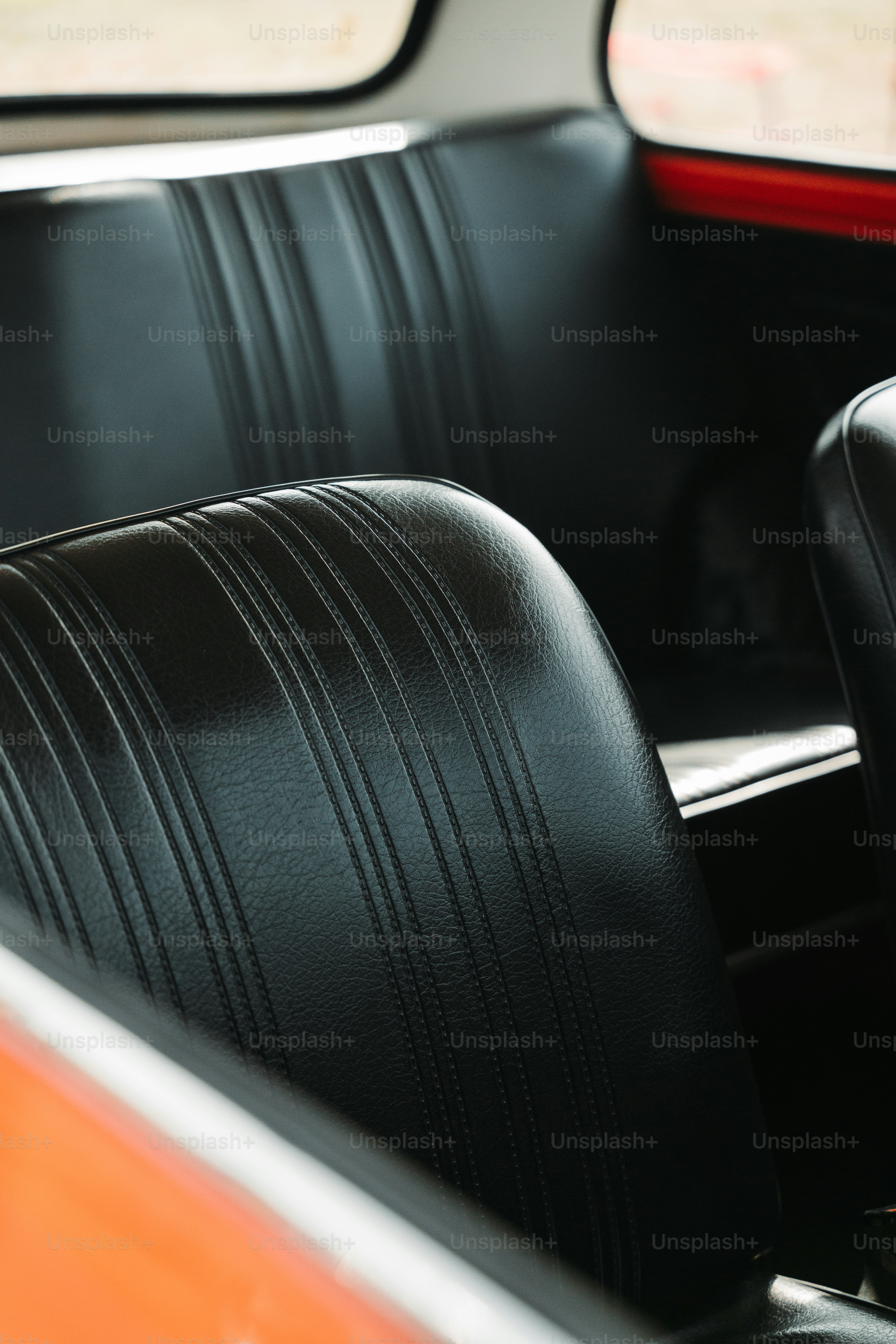 the interior of a car with black leather seats