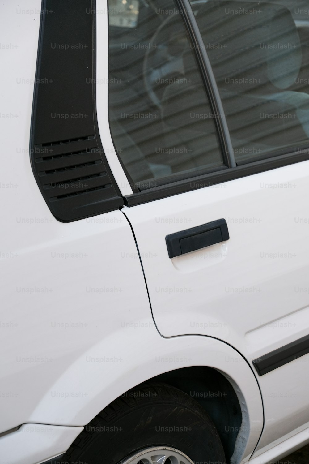 a close up of a white van with the door open