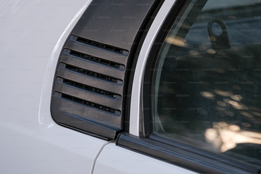 a close up of a car's side window