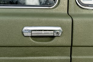 a close up of a door handle on a vehicle