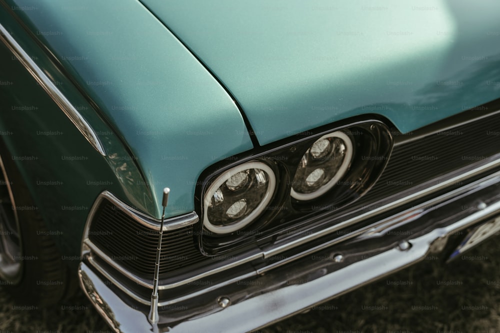 a close up of the front of a green car