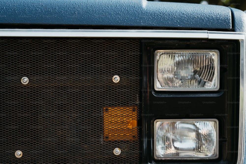 a close up of the headlights of a truck