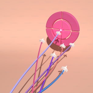 a bunch of blue and pink wires on a pink surface
