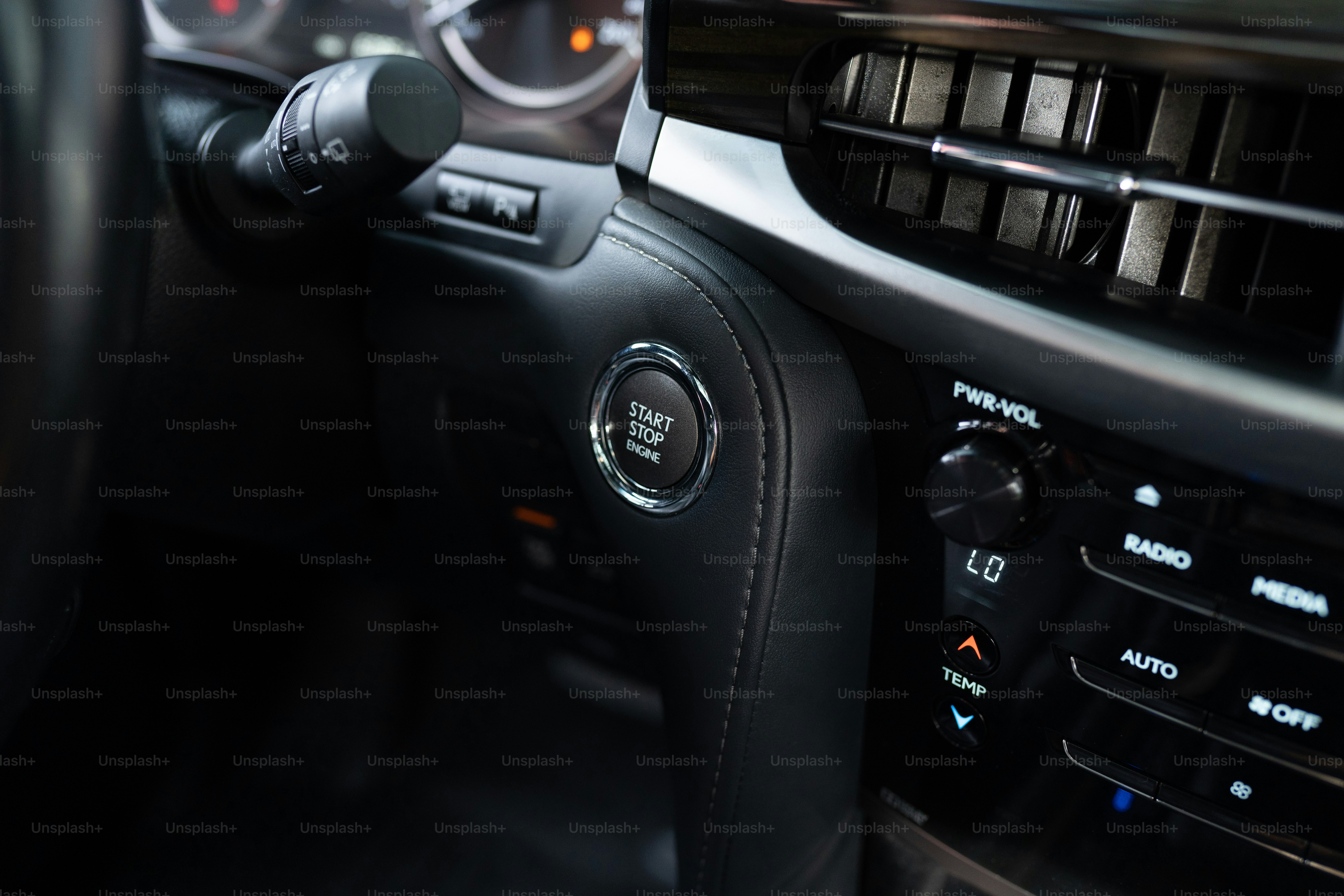 a close up of a steering wheel and dashboard of a car