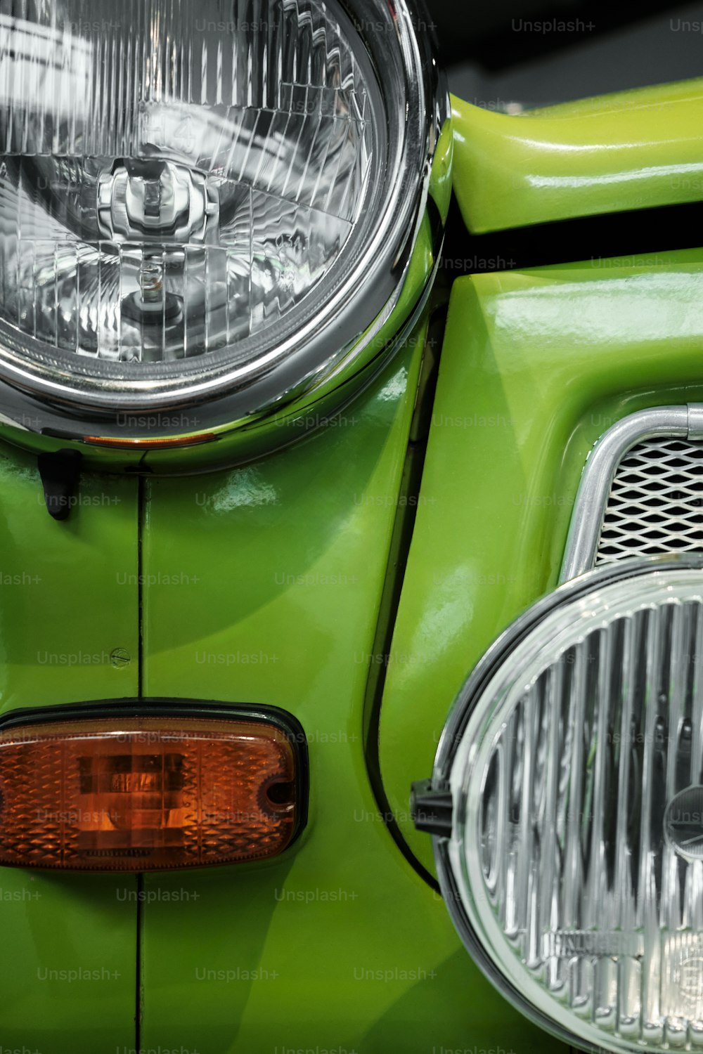 a close up of the front of a green motorcycle