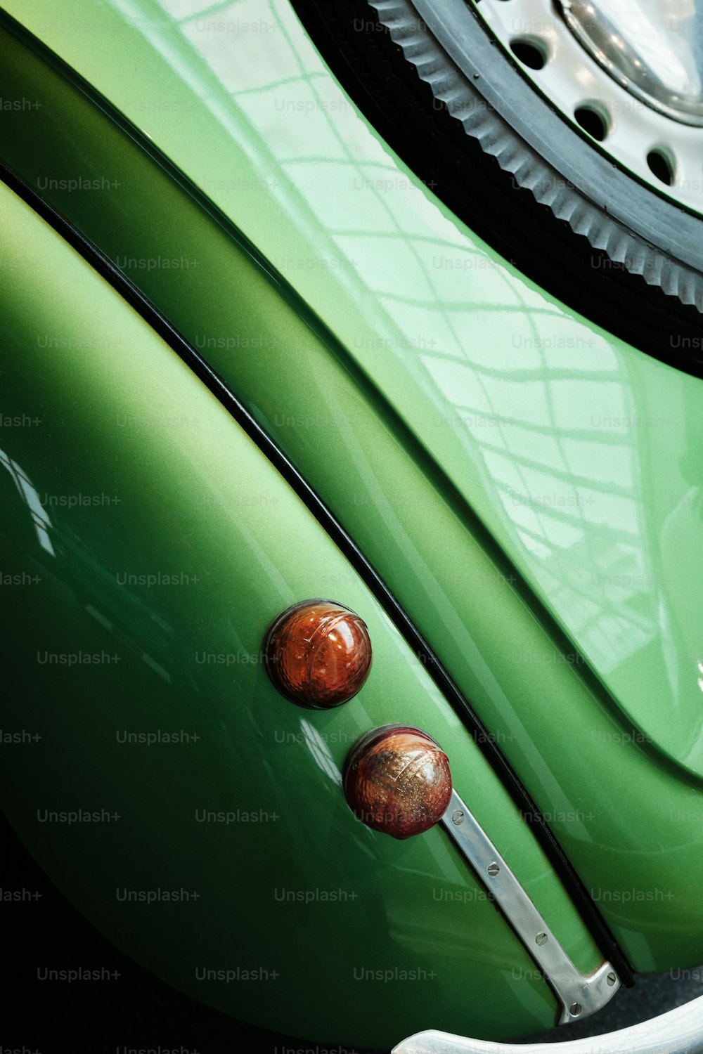 a close up of the front of a green car