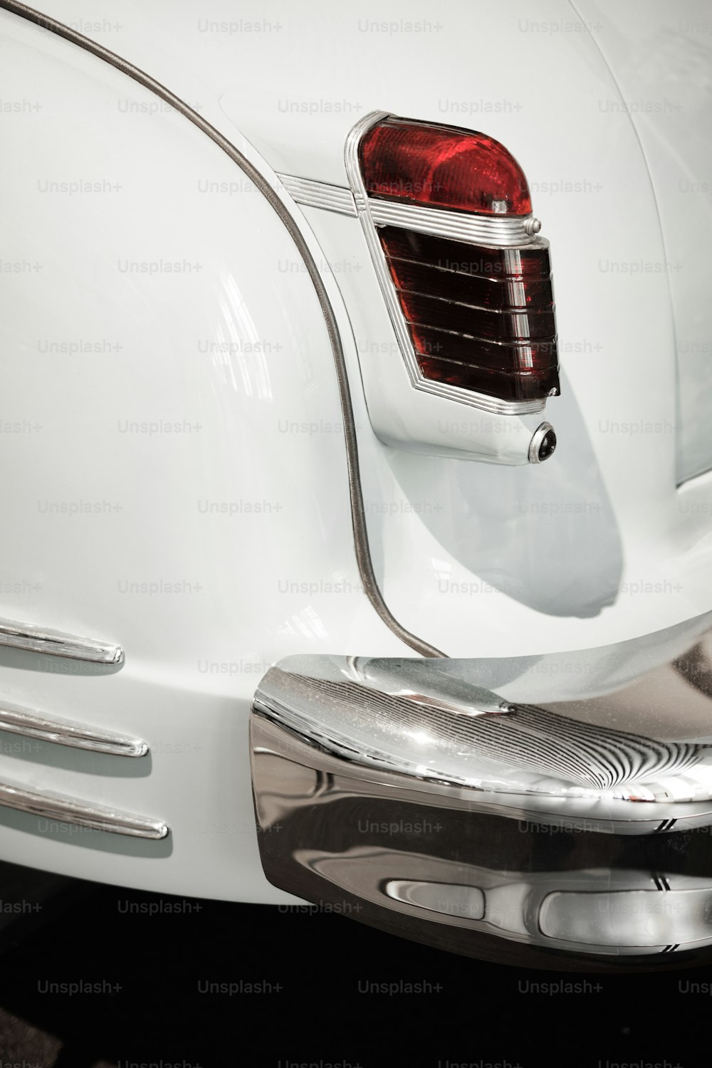 a close up of the tail end of a classic car