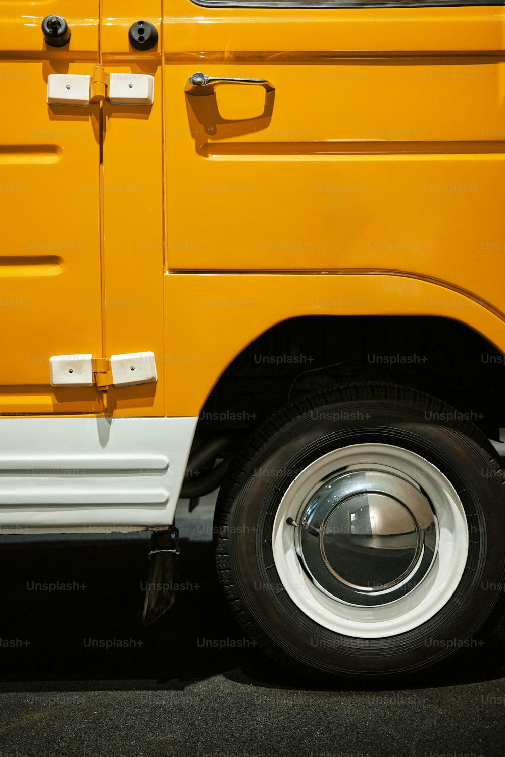 a close up of the front of a yellow truck