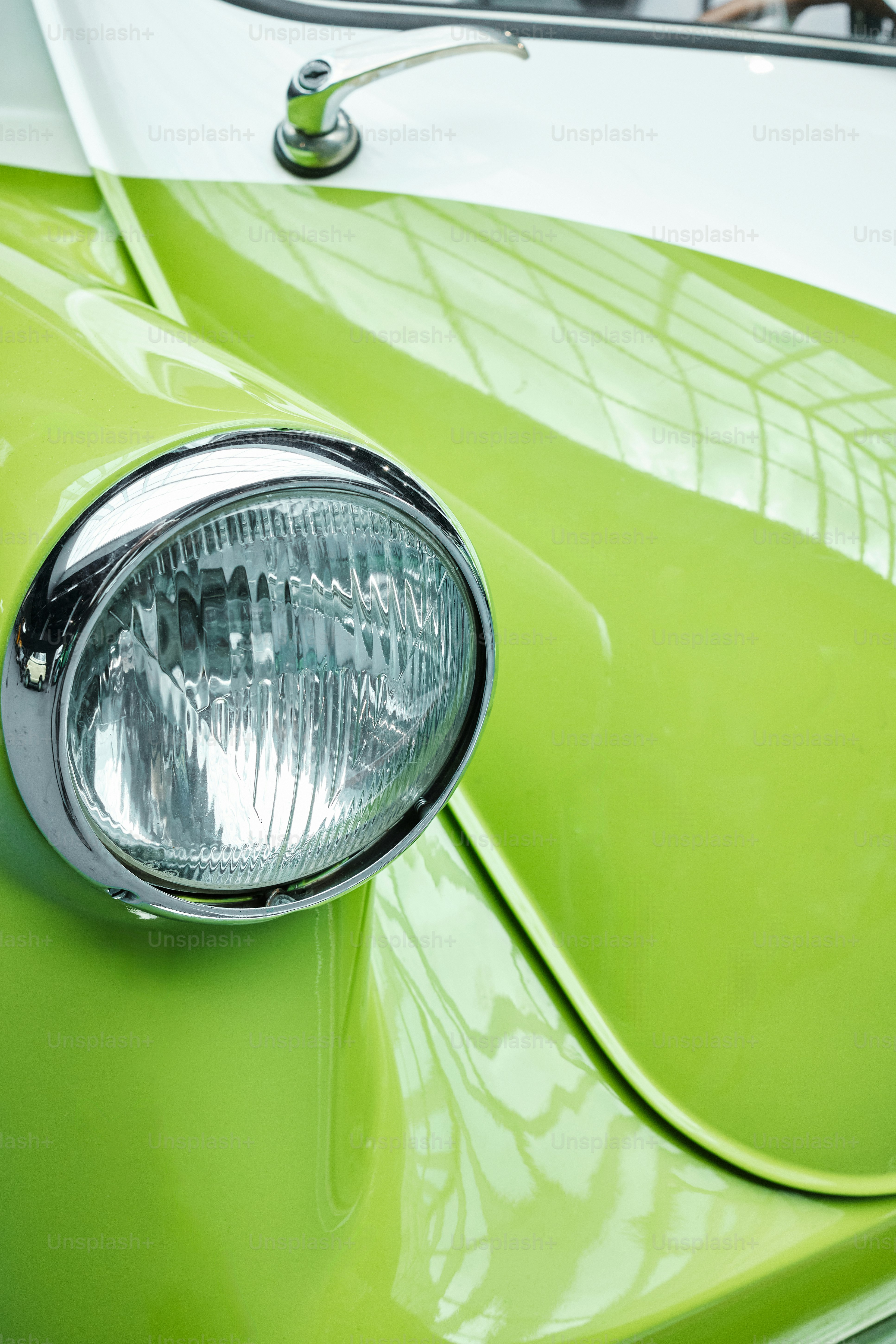 a close up of the front of a green car
