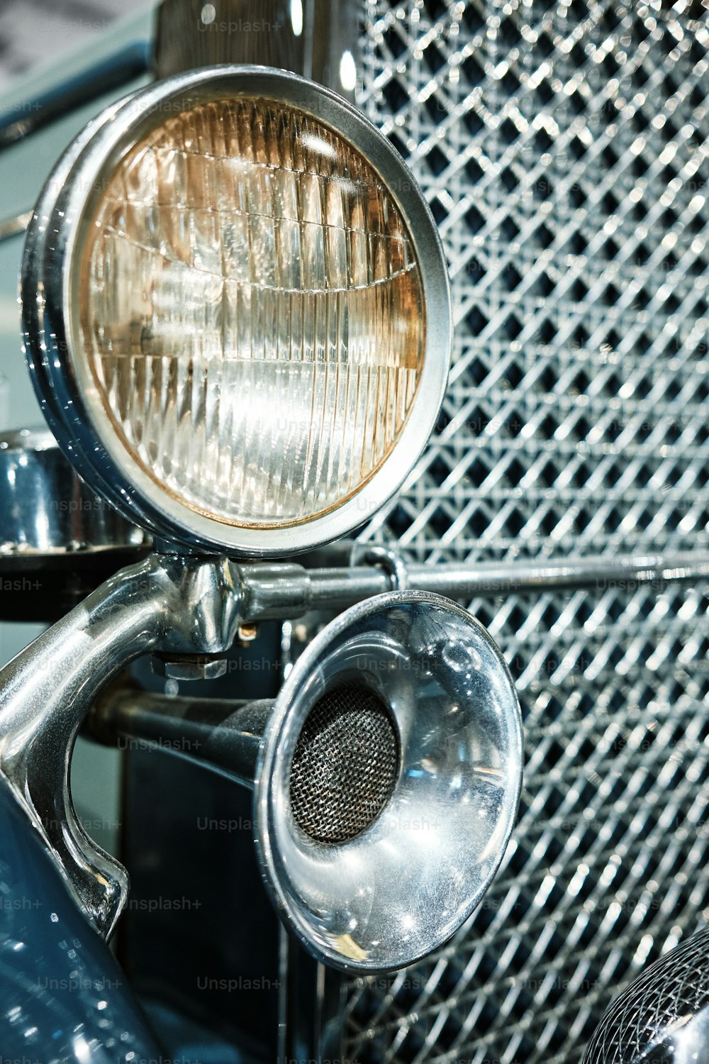 a close up of the front of a classic car