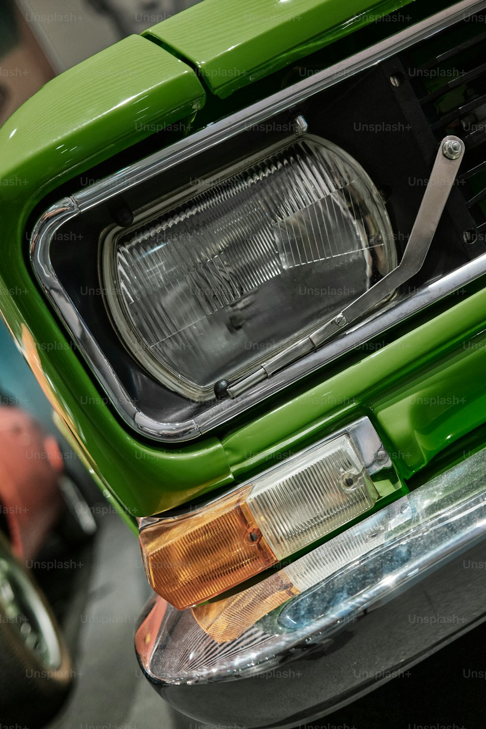a close up of the front of a green car