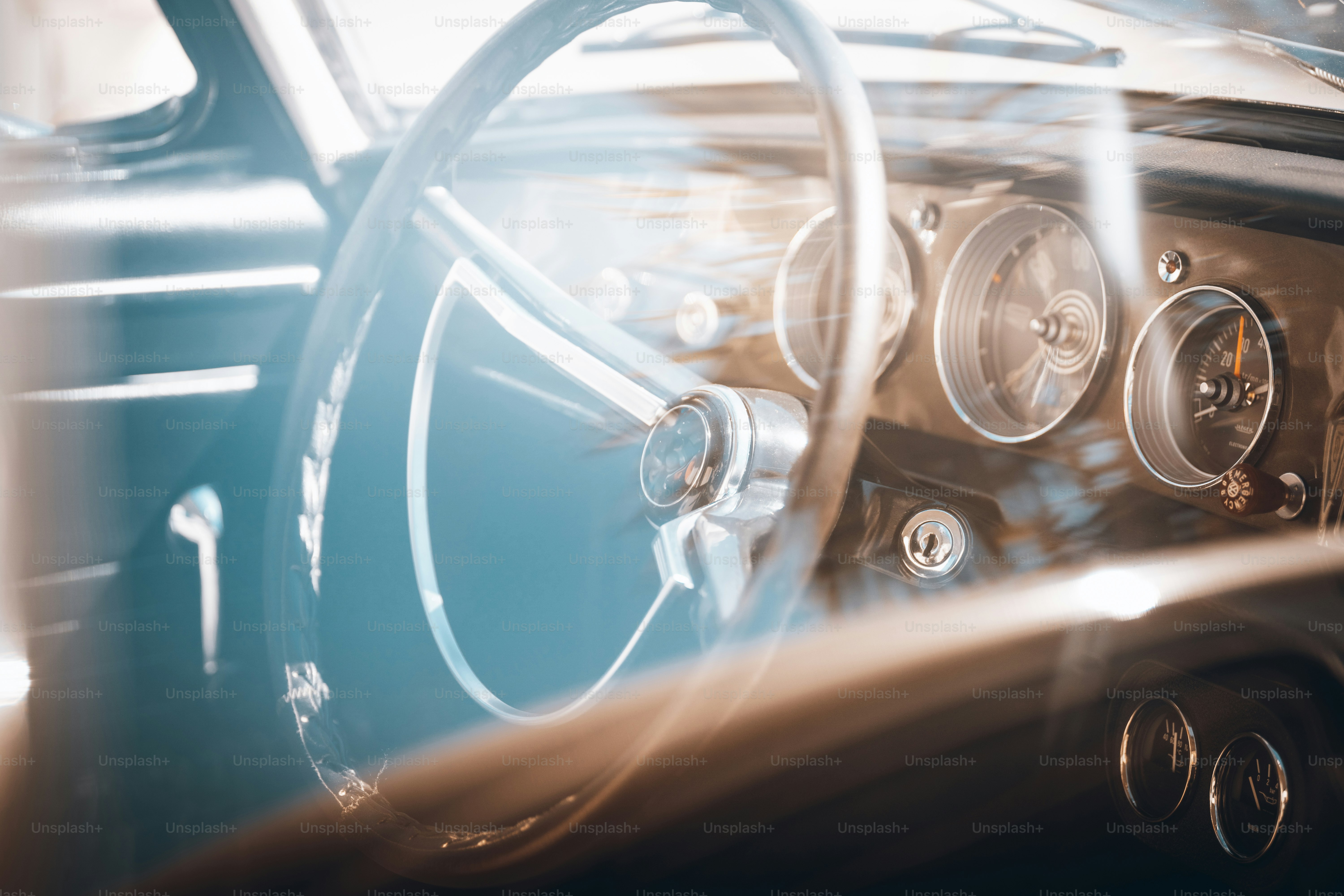 a close up of a steering wheel and dashboard of a car