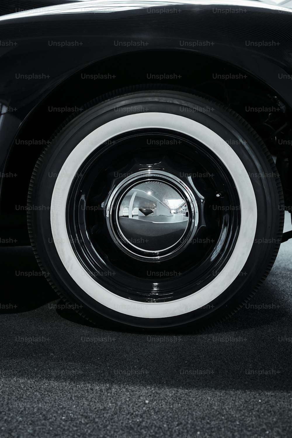 a close up of a black and white car tire