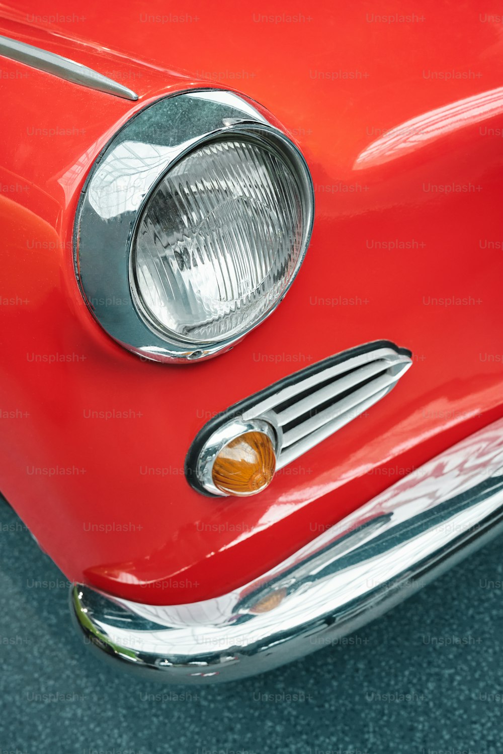 a close up of a red car headlight